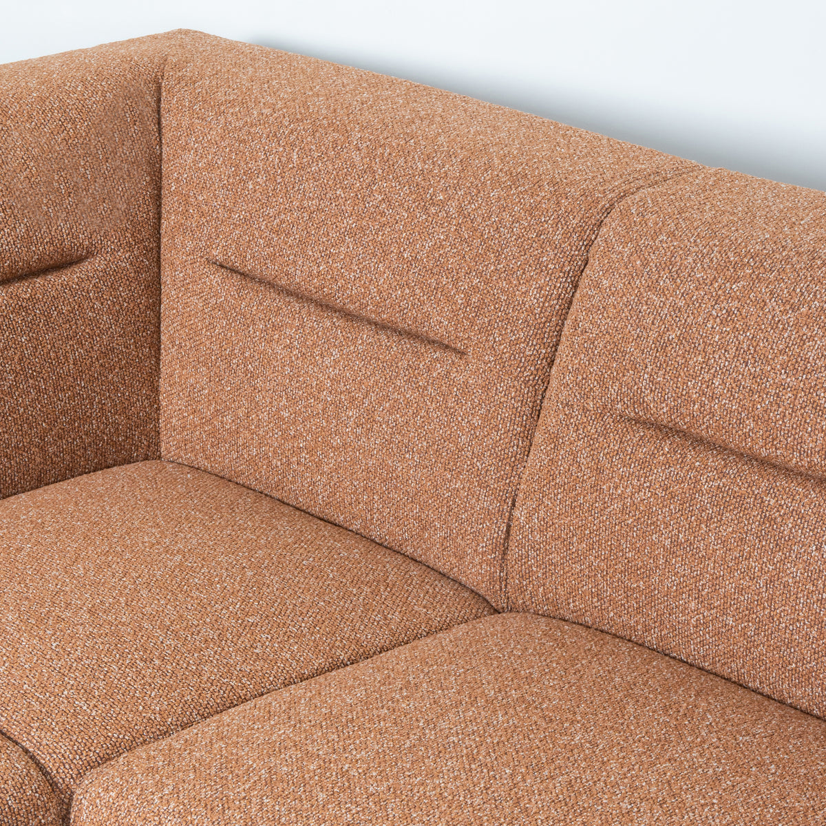 Hoekbank Bolzano rood bouclé magazijn leegverkoop, detail van het materiaal